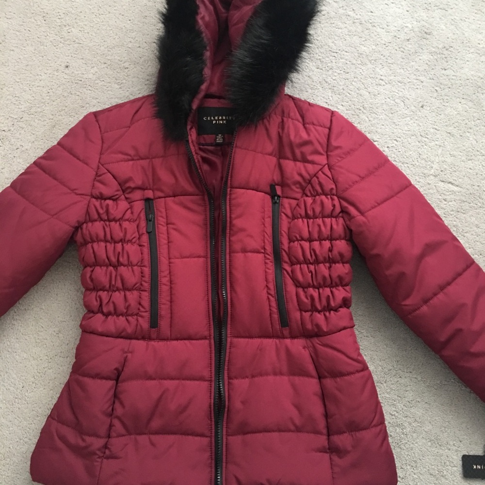 maroon puffer coat with black fur trim hood